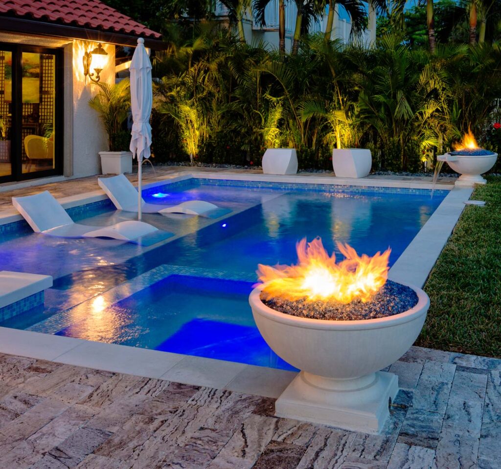 Custom fire feature next to pool and spa.