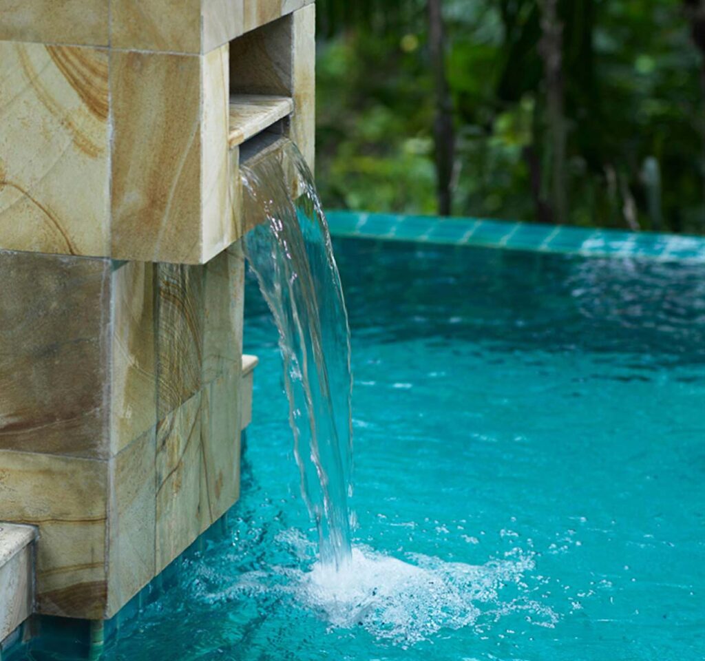 Custom waterfall into pool.